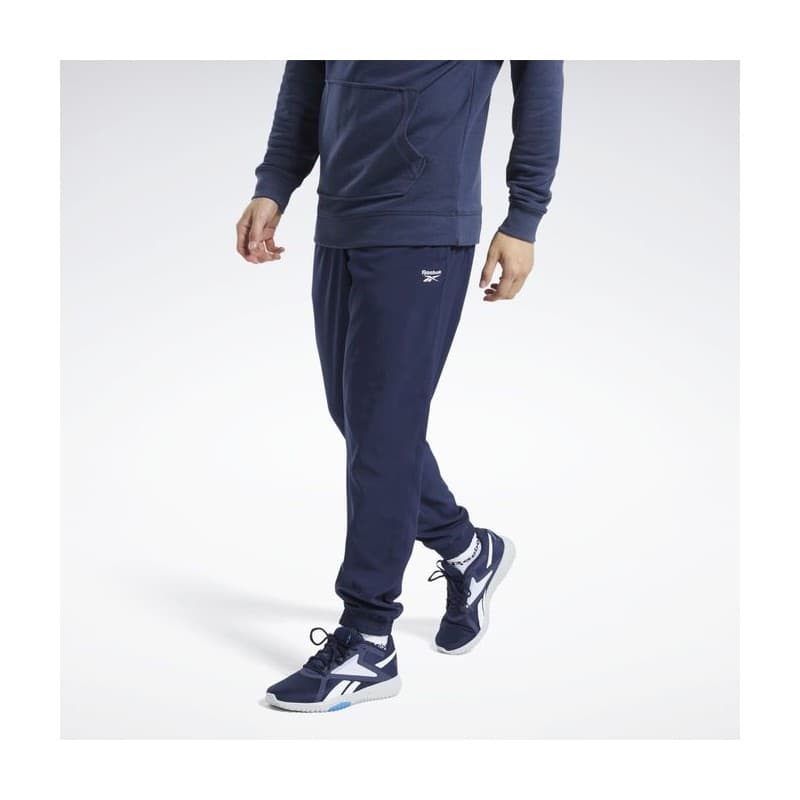 Reebok Mens' Training Essentials Woven Cuffed Pants- بنطلون ريبوك ترينيغ ايسنشيال ويفن للرجال لون أزرق