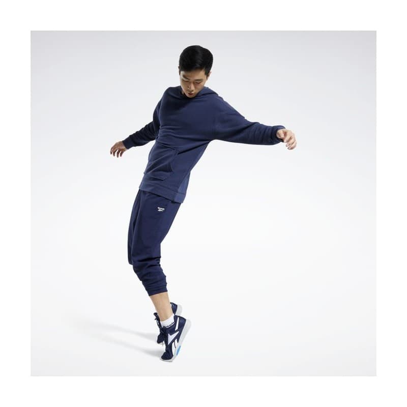 Reebok Mens' Training Essentials Woven Cuffed Pants- بنطلون ريبوك ترينيغ ايسنشيال ويفن للرجال لون أزرق