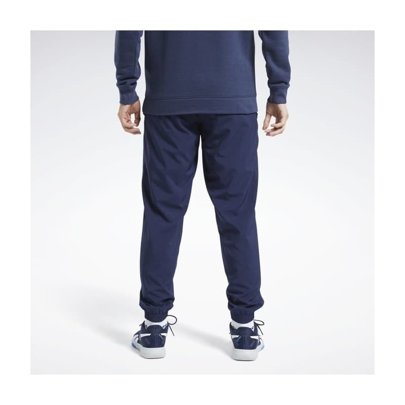 Reebok Mens' Training Essentials Woven Cuffed Pants- بنطلون ريبوك ترينيغ ايسنشيال ويفن للرجال لون أزرق
