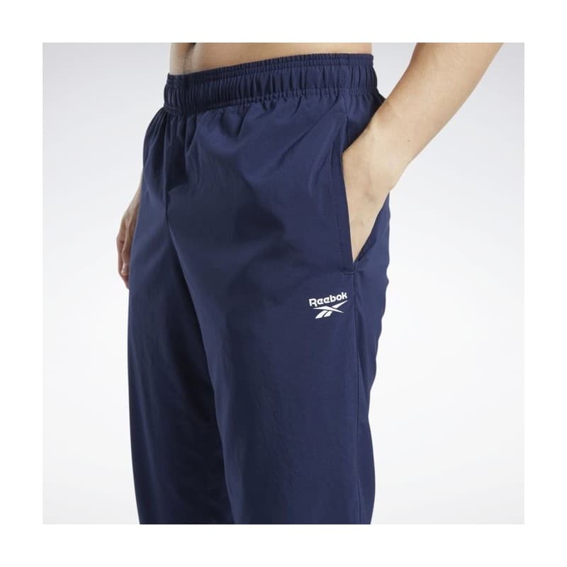 Reebok Mens' Training Essentials Woven Cuffed Pants- بنطلون ريبوك ترينيغ ايسنشيال ويفن للرجال لون أزرق