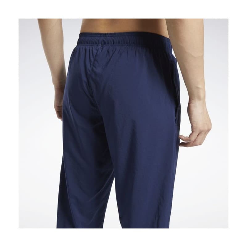 Reebok Mens' Training Essentials Woven Cuffed Pants- بنطلون ريبوك ترينيغ ايسنشيال ويفن للرجال لون أزرق
