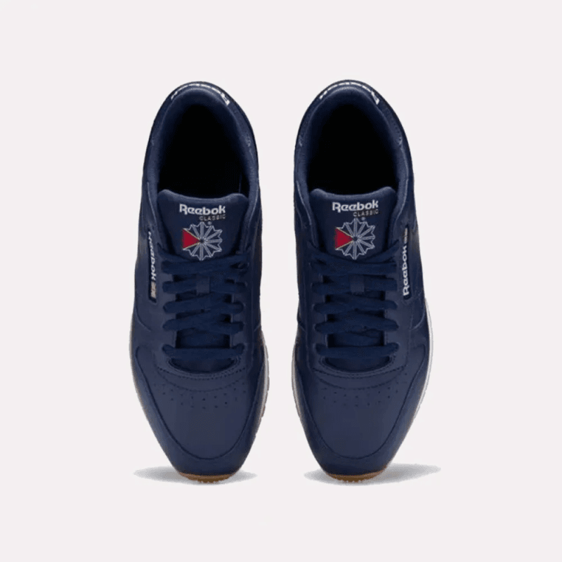 حذاء ريبوك كلاسيد ليذر للجنسين لون كحلي ونعل أبيض- Reebok Classic Leather Shoes