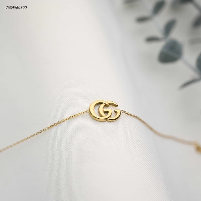 سوار ماركة+حروف GG متداخلة لون ذهبي